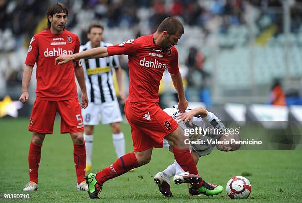 Sebastian Giovinco of Juventus FC battles for the ball with Michele Canini of Cagliari Calcio during the Serie A match between Juventus FC and...