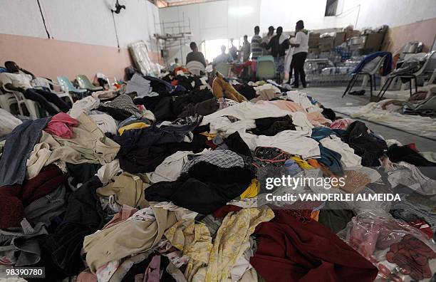 Volunteers organize clothes donated from all over Brazil to be given to victims a landslide in Vicoso Jardim Bumba shantytown in Niteroi, 25 km from...