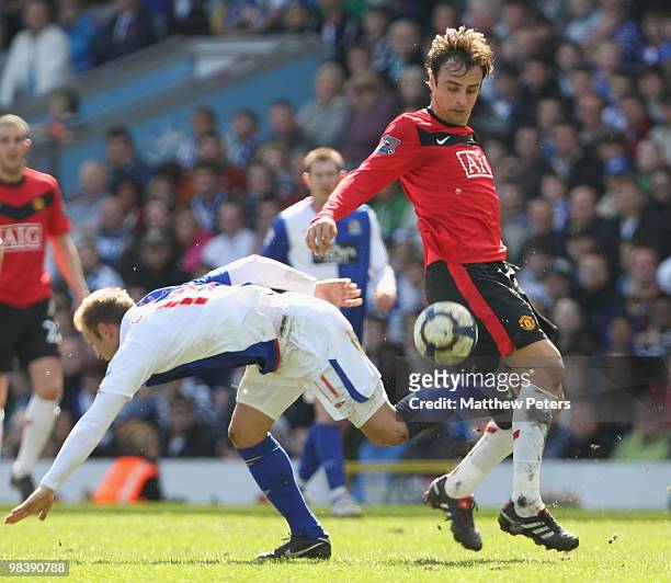 Dimitar Berbatov of Manchester United clashes with Vince Grella of Blackburn Rovers during the FA Barclays Premier League match between Blackburn...