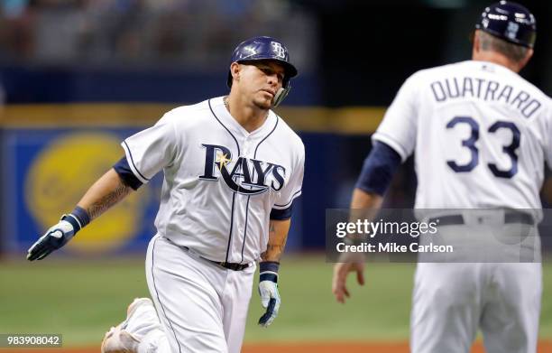 Wilson Ramos of the Tampa Bay Rays is congratulated by third base coach Matt Quatraro after his home run in the sixth inning of a baseball game...