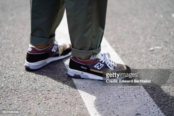 Guest wears New Balance sneakers shoes, outside Paul Smith, during Paris Fashion Week - Menswear Spring-Summer 2019, on June 24, 2018 in Paris,...