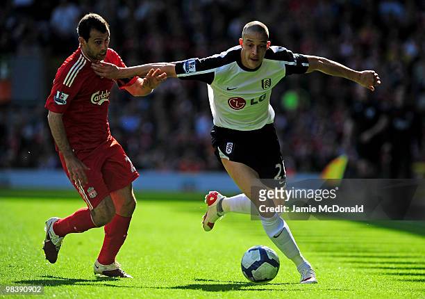 Bobby Zamora of Fulham battles for the ball with Javier Mascherano of Liverpool during the Barclays Premier League match between Liverpool and Fulham...