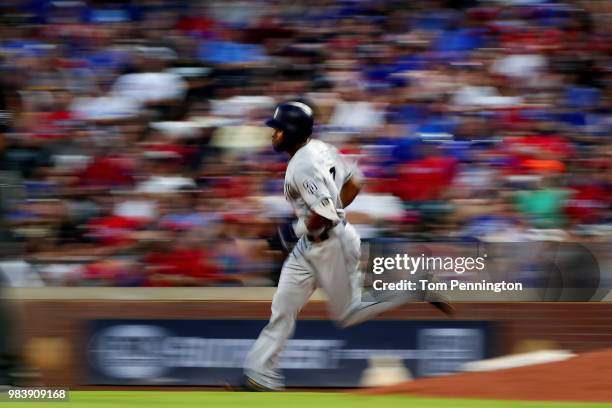 Manuel Margot of the San Diego Padres rounds the bases after hitting a three-run home run against the Texas Rangers in the top of the fifth inning at...