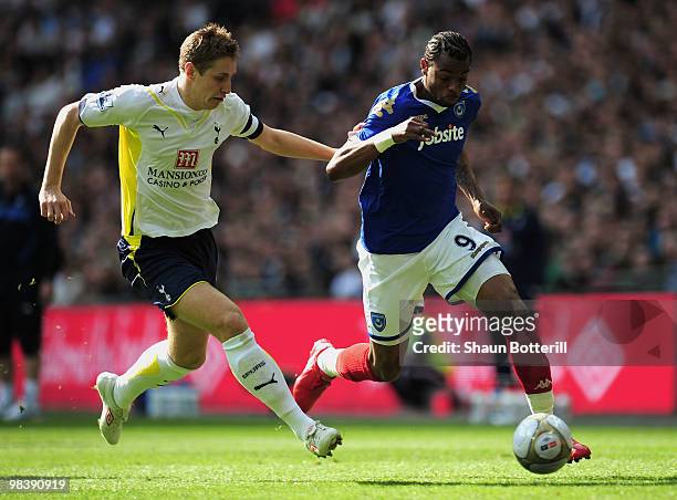 Michael Dawson of Tottenham Hotspur and Frederic Piquionne of Portsmouth battles for the ball during the FA Cup sponsored by E.ON Semi Final match...