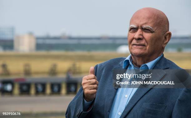 Year-old Berliner Alexander Kulpok, who witnessed the Berlin Airlift first hand, poses in front of Berlin's disused Tempelhof Airport on June 25,...