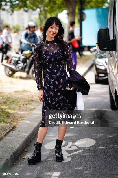 Model Choi Sora wears a black mesh flower print dress, outside Balmain, during Paris Fashion Week - Menswear Spring-Summer 2019, on June 24, 2018 in...