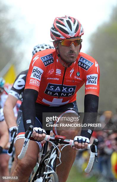 Swiss Fabian Cancellara leaves the cobblestone section "La tranchée d'Aramberg" during the 108th edition of the Paris-Roubaix cycling race between...