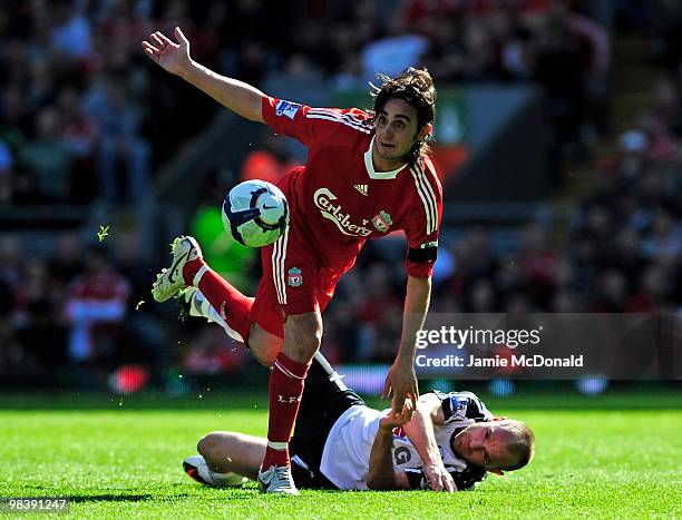 Alberto Aquilani of Liverpool tangles with Danny Murphy of Fulham during the Barclays Premier League match between Liverpool and Fulham at Anfield on...