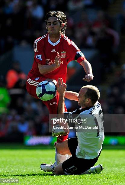 Alberto Aquilani of Liverpool tangles with Danny Murphy of Fulham during the Barclays Premier League match between Liverpool and Fulham at Anfield on...