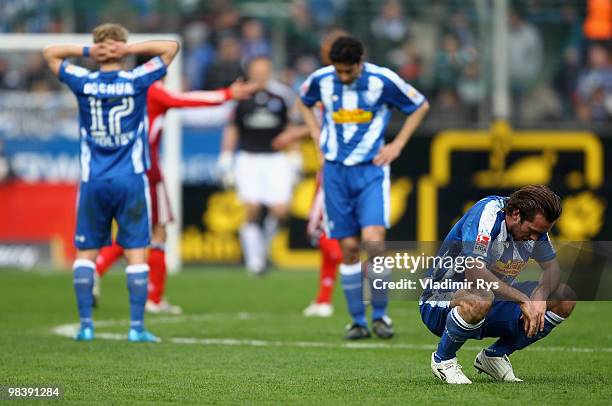 Christian Fuchs and his team mates of Bochum look dejected after the Bundesliga match between VfL Bochum and Hamburger SV at Rewirpower Stadium on...