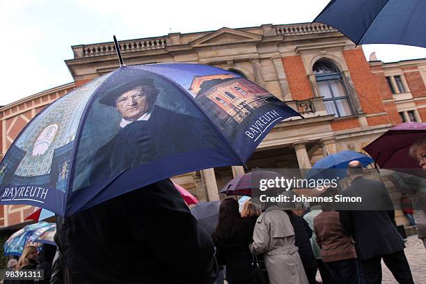 An umbrella showing the portrait of German composer Richard Wagner during the funeral service for Wolfgang Wagner in front of festival opera house on...