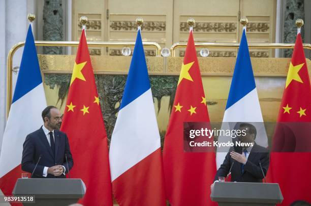 Chinese Premier Li Keqiang and French Prime Minister Edouard Philippe hold a joint press conference at the Great Hall of the People in Beijing on...
