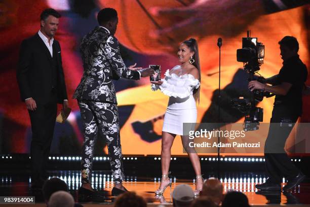 Actor Josh Duhamel and Adrienne Bailon present Victor Oladipo of the Indiana Pacers with the award for Most Imporoved Player during the 2018 NBA...