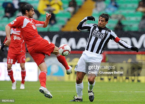 Ignacio Castillo of Bari and Simone Vergassola in action during the Serie A match between AC Siena and AS Bari at Stadio Artemio Franchi on April 11,...