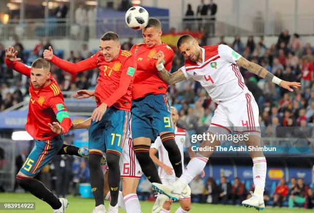 Rodrigo Moreno of Spain and Manuel da Costa of Morocco compete for the ball during the 2018 FIFA World Cup Russia group B match between Spain and...