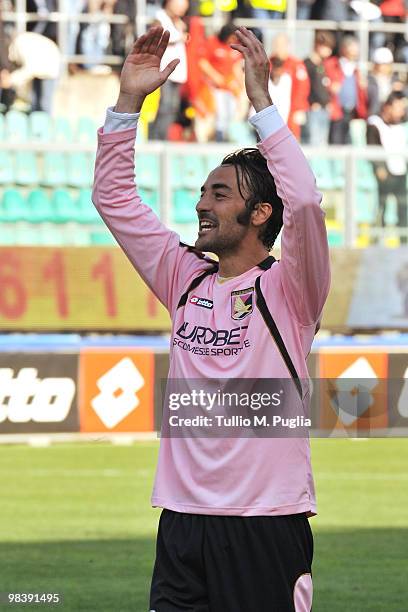 Mattia Cassani of Palermo celebrates after winning the Serie A match between US Citta di Palermo and AC Chievo Verona at Stadio Renzo Barbera on...