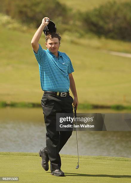 James Morrison of England celebrates after winning the final round of the Madeira Islands Open at the Porto Santo golf club on April 11, 2010 in...