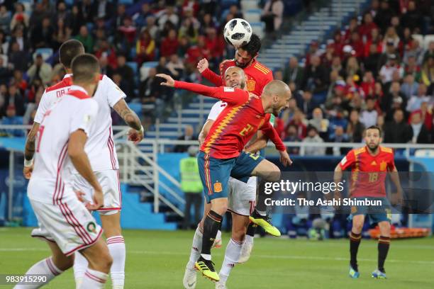 Isco of Spain and Noureddine Amrabat of Morocco compete for the ball during the 2018 FIFA World Cup Russia group B match between Spain and Morocco at...