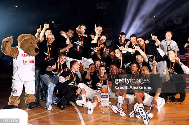 Players of Brose Baskets Bamberg celebrate after winning the Beko BBL Top Four basketball tournament against Deutsche Bank Skyliners Frankfurt at the...