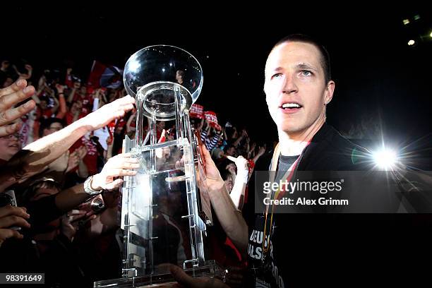 Casey Jacobsen of Brose Baskets Bamberg celebrates with supporters after winning the Beko BBL Top Four basketball tournament against Deutsche Bank...