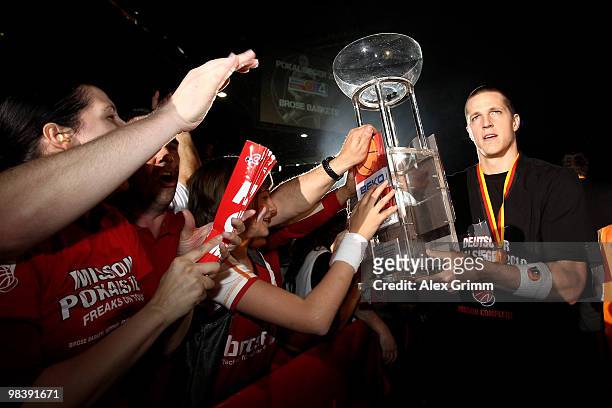 Casey Jacobsen of Brose Baskets Bamberg celebrates with supporters after winning the Beko BBL Top Four basketball tournament against Deutsche Bank...