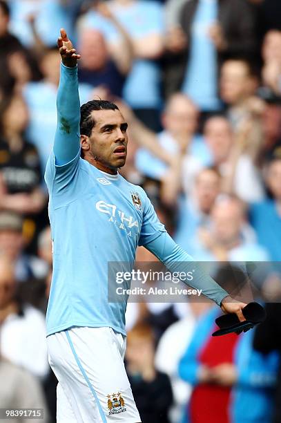 Carlos Tevez of Manchester City celebrates scoring their first goal from the penalty spot during the Barclays Premier League match between Manchester...