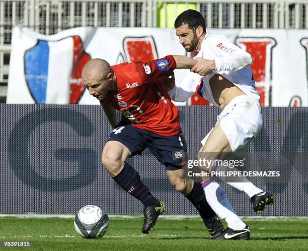 Lille's French midfielder Florent Balmont fights with Lyon's Argentinian forward Lisandro Lopez during the French L1 football match Lyon vs Lille, on...