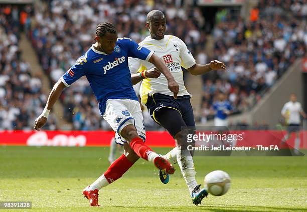 Frederic Piquionne of Portsmouth battles for the ball with Sebastien Bassong of Tottenham Hotspur during the FA Cup sponsored by E.ON Semi Final...