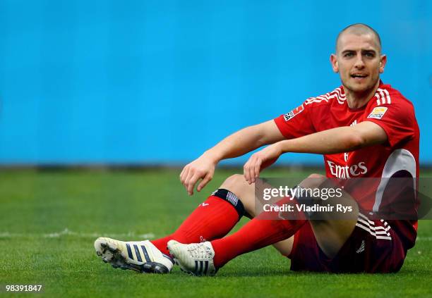 Mladen Petric of Hamburg sits on the pitch during the Bundesliga match between VfL Bochum and Hamburger SV at Rewirpower Stadium on April 11, 2010 in...