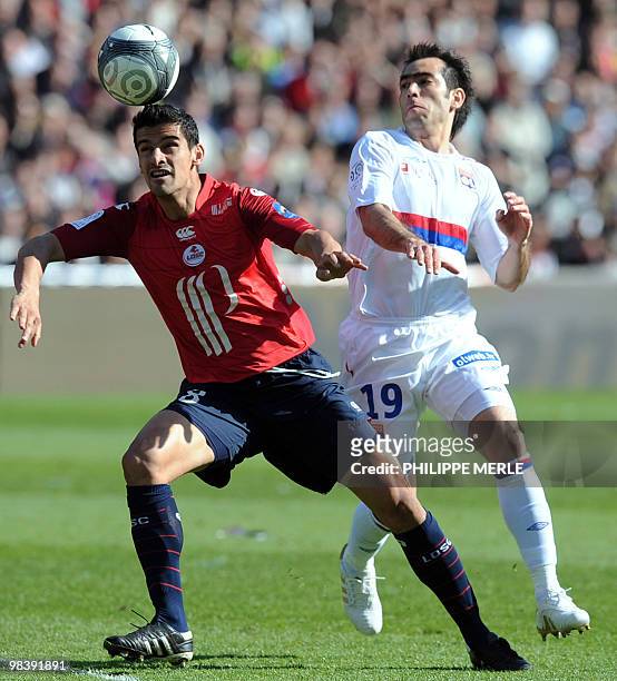 Lille Morroco defender Adil Rami vies with Lyon's Argentinian middfielder Cesar Delgado during the French L1 football match Lyon vs Lille, on April...