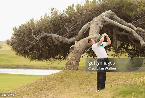 Oliver Fisher of England in action during the final round of the Madeira Islands Open at the Porto Santo golf club on April 11, 2010 in Porto Santo...