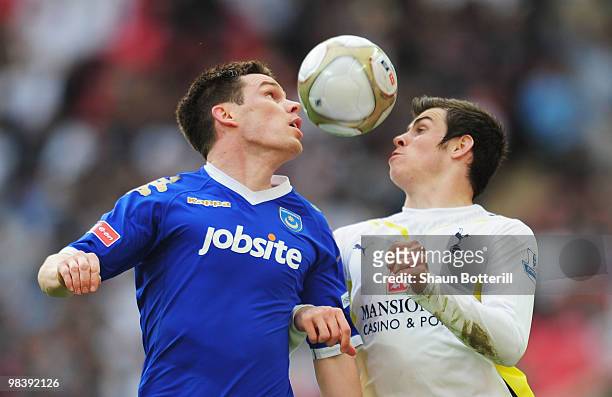 Steve Finnan of Portsmouth and Gareth Bale of Tottenham Hotspur compete for the ball during the FA Cup sponsored by E.ON Semi Final match between...
