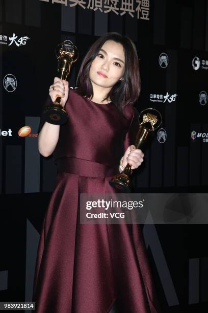 Singer-songwriter Lala Hsu poses with her trophies at backstage of the 29th Golden Melody Awards ceremony on June 23, 2018 in Taipei, Taiwan of China.