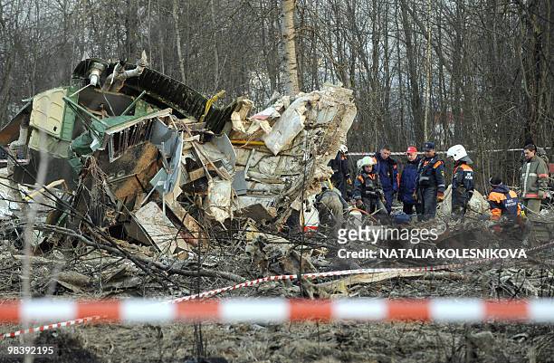 Russian rescuers inspect the wreckage of a Polish government Tupolev Tu-154 aircraft which crashed on April 10 near Smolensk airport, on April 11,...
