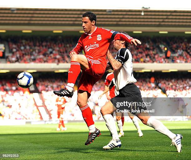 Maxi Rodriguez of Liverpool competes with Jonathan Greening of Fulham during the Barclays Pemier League match between Liverpool Fulham at Anfield on...