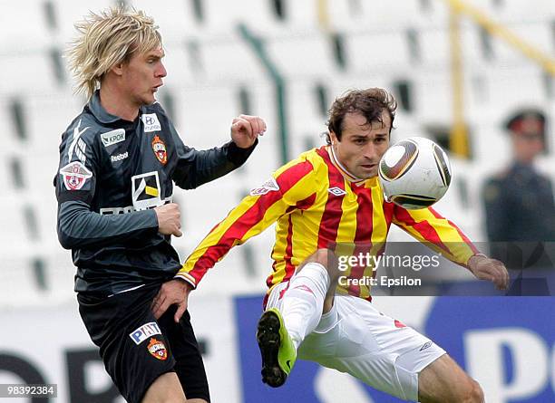 Ibrahim Gnanou of FC Alania Vladikavkaz fights for the ball with Milos Krasic of PFC CSKA Moscow during the Russian Football League Championship...