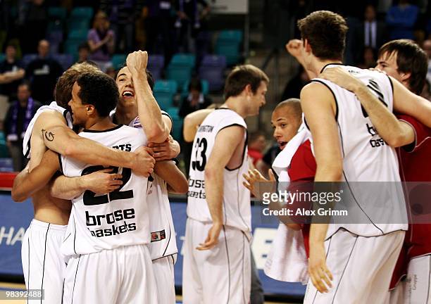 Players of Brose Baskets Bamberg celebrate after winning the Beko BBL Top Four basketball tournament against Deutsche Bank Skyliners Frankfurt at the...