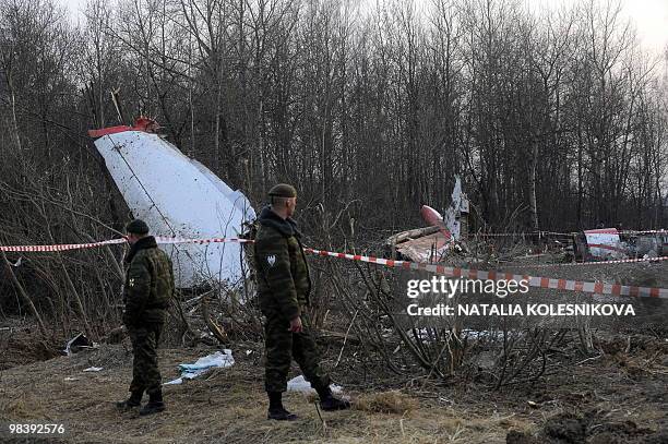 Soldiers of the Russian Interior Ministry stand guard on April 11, 2010 near the wreckage of a Polish government Tupolev Tu-154 aircraft which...
