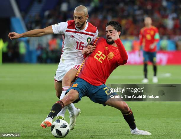 Isco of Spain and Noureddine Amrabat of Morocco compete for the ball during the 2018 FIFA World Cup Russia group B match between Spain and Morocco at...