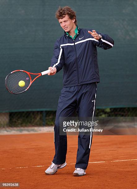 Tomas Berdych of Czech Republic hits balls to kids in a coaching clinic during previews for the ATP Masters Series Monte Carlo Tennis on April 11,...