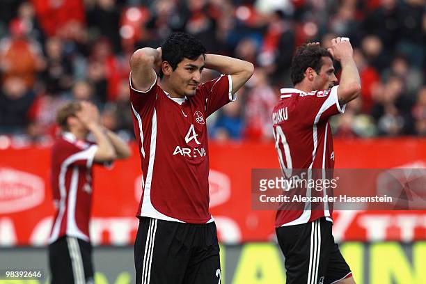 Ilkay Guendogan of Nuernberg reacts with his team mates Albert Bunjaku and Marcel Risse during the Bundesliga match between 1. FC Nuernberg and VfL...
