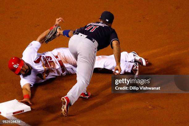 Matt Carpenter of the St. Louis Cardinals is tagged out at third base by Jose Ramirez of the Cleveland Indians in the first inning at Busch Stadium...