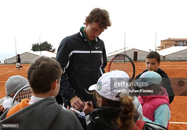 Tomas Berdych of Czech Republic signs autographs after a coaching clinic during previews for the ATP Masters Series Monte Carlo Tennis on April 11,...