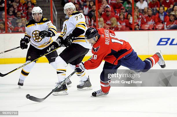 Eric Belanger of the Washington Capitals shoots and scores in the first period against the Boston Bruins at the Verizon Center on April 11, 2010 in...