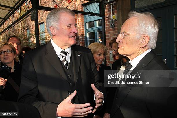 Bavarian state governor Horst Seehofer and former Bavarian state governor Edmund Stoiber chat together after the funeral service for Wolfgang Wagner...