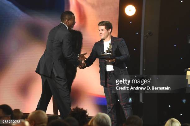 Adam DeVine presents Head Coach Dwayne Casey of the Detroit Pistons with an award during the 2018 NBA Awards Show on June 25, 2018 at The Barkar...