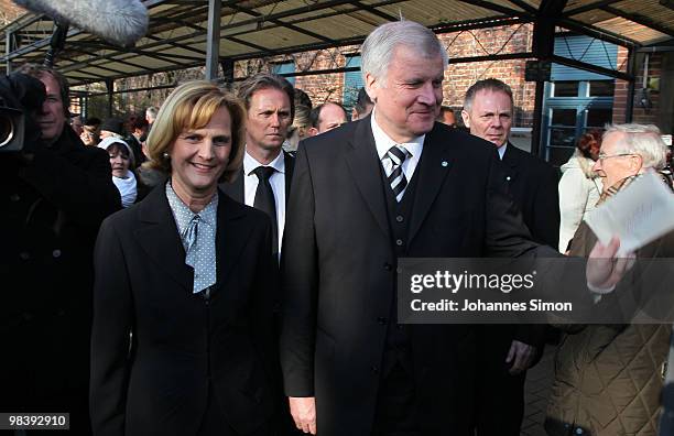 Bavarian state Govenor Horst Seehofer and wife Karin leave the funeral service for Wolfgang Wagner at festival opera house on April 11, 2010 in...
