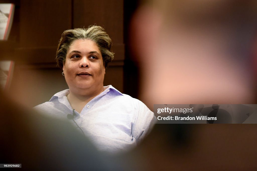 Roxane Gay Signs Copies Of Her Two Novels "Not That Bad" And "Hunger"