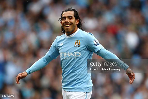 Carlos Tevez of Manchester City smiles during the Barclays Premier League match between Manchester City and Birmingham City at Eastlands, City of...