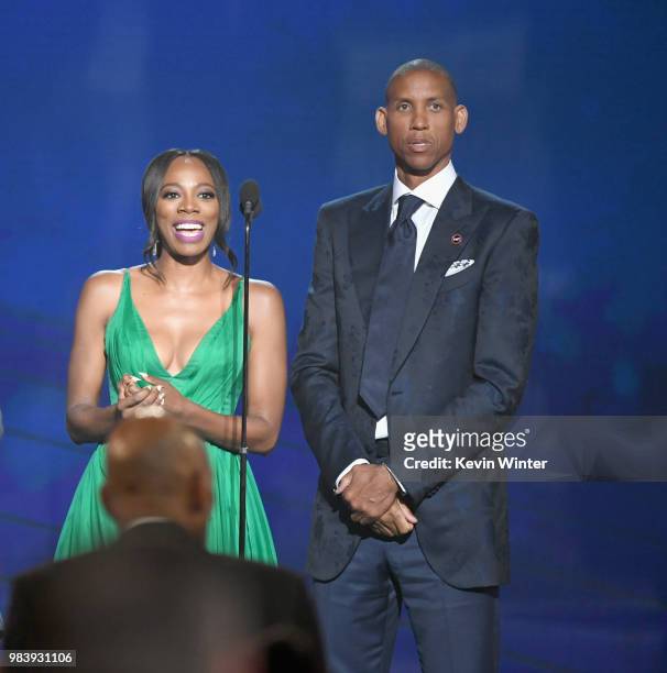Yvonne Orji and Reggie Miller speak onstage at the 2018 NBA Awards at Barkar Hangar on June 25, 2018 in Santa Monica, California.